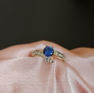 18k gold ring royal blue tanzanite round center stone with crystals gift